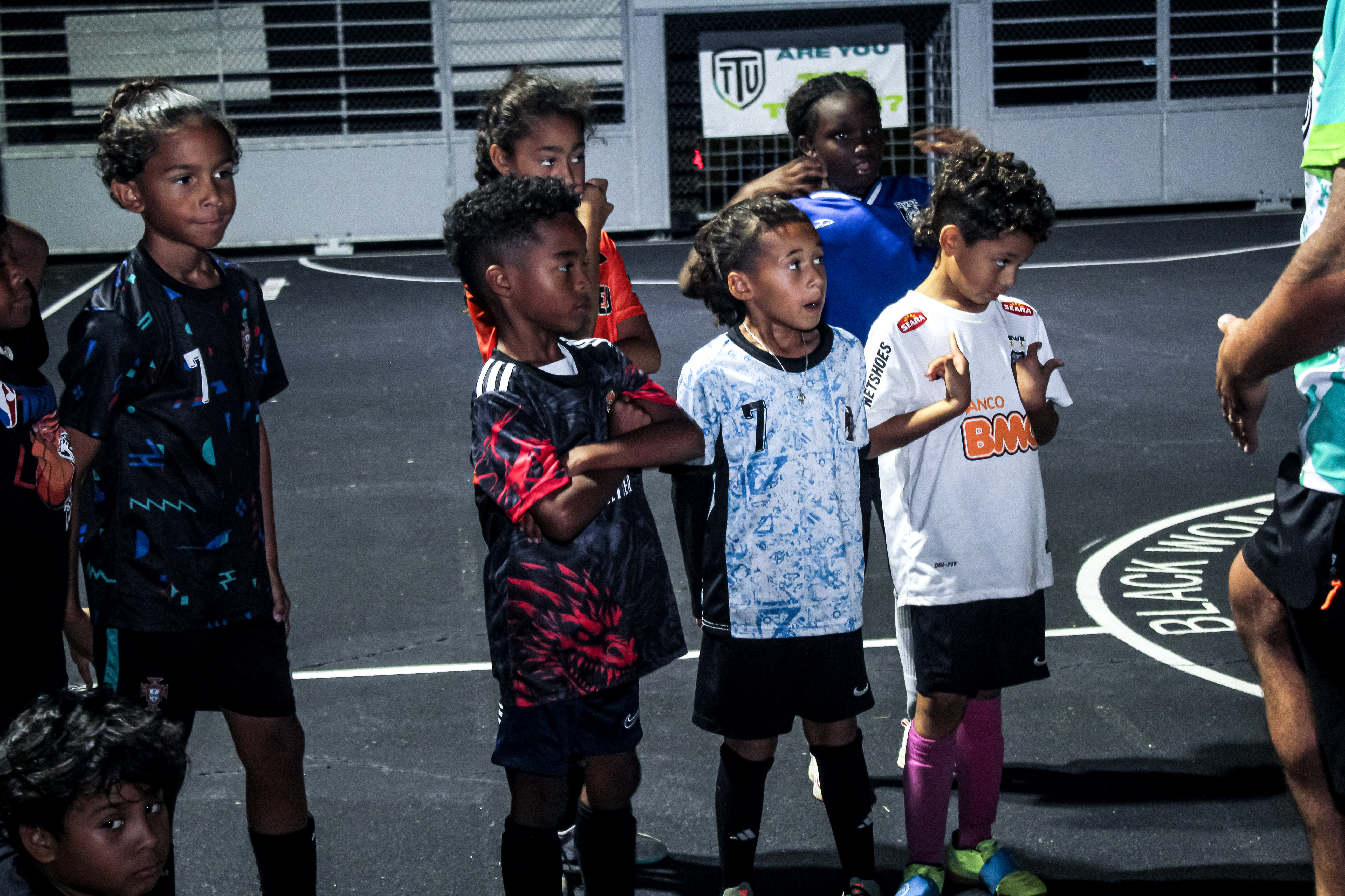 Parents and players smiling on the sideline after a TrueTouch session